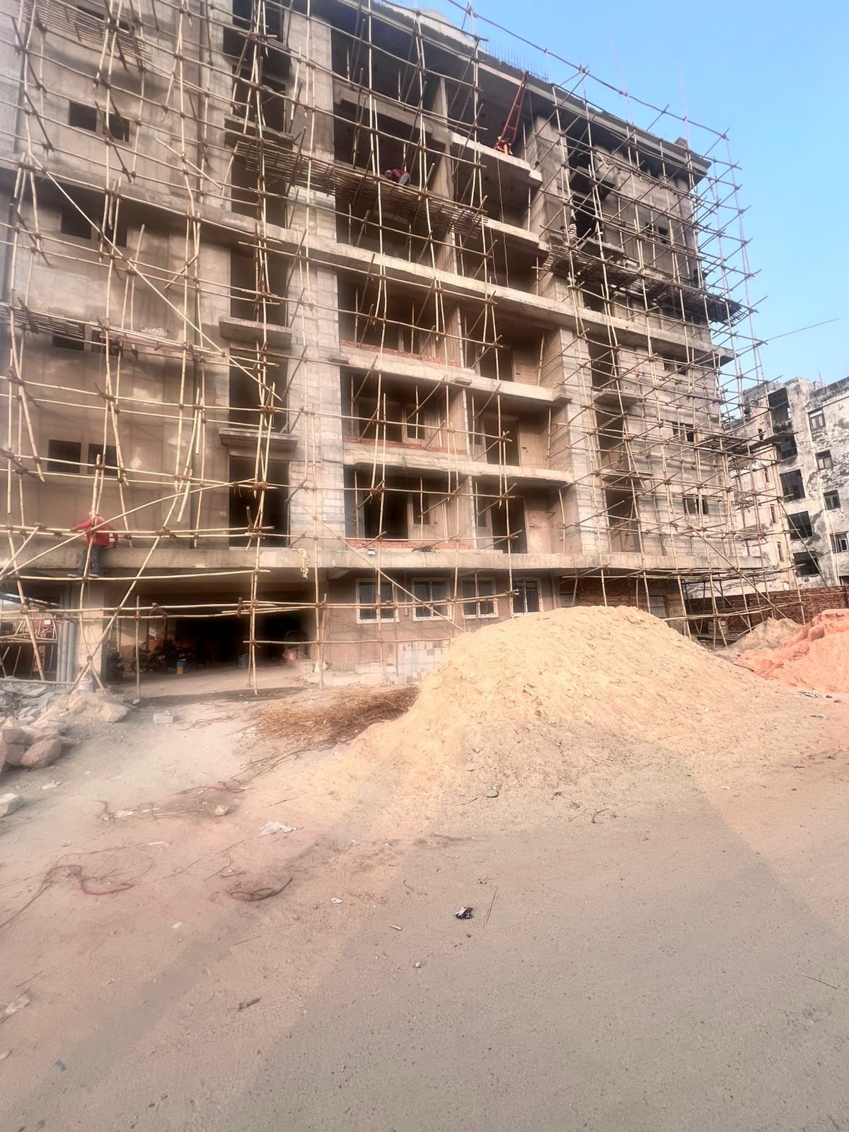 Construction progress at Mangal Deep - full tower elevation under finishing